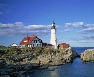 Light House Prints: Portland Head lighthouse on rocky coast at Cape Elizabeth