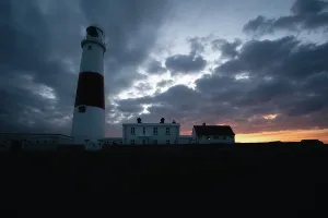 Portland Prints: Portland Bill Lighthouse with sunset behind, Portland, Dorset, UK