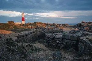 Quarry Prints: Portland Bill Lighthouse at sunset with remnants of limestone quarry in the foreground