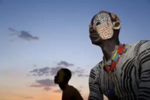 Portrait of a Karo tribesman with facial decoration in chalk imitating the spotted plumage of the guinea fowl, Lower Omo Valley