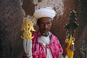 Ethiopian Prints: Portrait of a man holding Christian symbols, Gabriel and Raphael, Bieta Mercurios