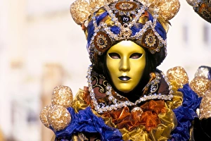 Portrait of a person dressed in mask and costume taking