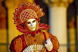 Portrait of a person dressed in mask and costume taking