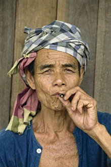 Head And Shoulder Prints: Portrait of refugee smoking