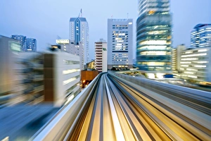 Images Dated 16th December 2010: POV blurred motion of Tokyo buildings from a moving train, Tokyo, Honshu, Japan, Asia