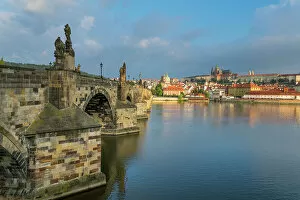 What's New: Prague Castle and Charles Bridge on Vltava River at sunrise, UNESCO World Heritage Site, Prague