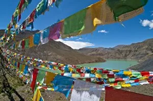 Images Dated 6th August 2010: Prayer flags above an artifical lake near the Karo-La Pass, Tibet, China, Asia