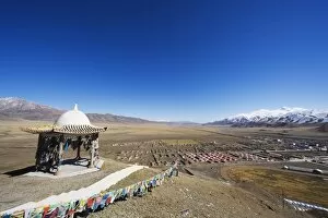 Prayer flags and sacred site overlooking the town of Bayanbulak, Xinjiang Province