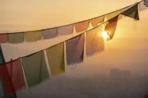 Bunting Prints: Prayer flags at Swayambhunath (Monkey Temple) in front of the city at sunrise, Kathmandu