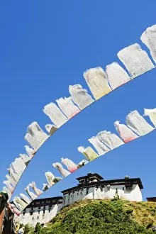 Images Dated 30th September 2009: Prayer flags below Wangdue Phodrang Dzong, founded by the Zhabdrung in 1638, Bhutan, Asia
