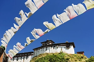Images Dated 30th September 2009: Prayer flags below Wangdue Phodrang Dzong, founded by the Zhabdrung in 1638, Bhutan, Asia