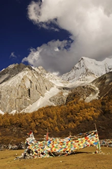 Prayer flags and Xiaruoduojio mountain, Yading Nature Reserve, Sichuan Province