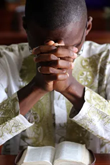 Hands Clasped Prints: Prayer, Sunday morning Catholic Mass, Lome, Togo, West Africa, Africa
