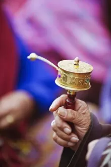 Images Dated 6th October 2009: Prayer wheels being spun by a pilgrims at the National Memorial Chorten