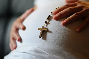 Rosary Prints: Pregnant woman with prayer beads, Paris, France, Europe