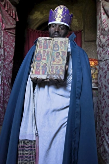 Lalibela Prints: Priest holding ancient manuscript, Ashetan Maryam, Lalibela, Ethiopia, Africa