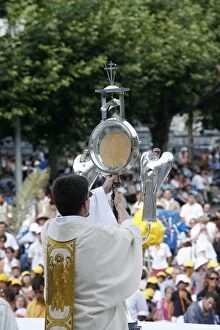 Priest holding the holy sacrament, Lourdes, Hautes Pyrenees, France, Europe