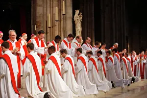 Touching Prints: Priest ordinations in Notre Dame cathedral, Paris, France, Europe