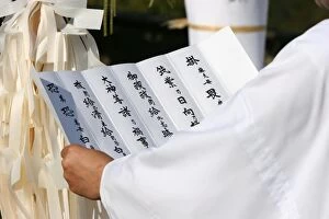 Priest reading a prayer for peace at Shinto ceremony, Lyon, Rhone, France, Europe
