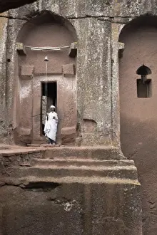 Ethiopian Prints: A priest stands at the entrance to the rock-hewn church of Bet Gabriel-Rufael
