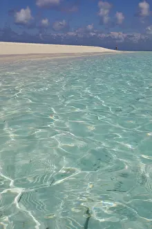 Adventures Prints: Pristine shallow waters lap against the white coral sand of a tropical beach; Havodda Island