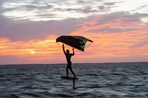 Young Man Prints: Pro surfer James Jenkins on his wing surfer flies across the Pamlico Sound at Nags Head