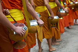 Alms Prints: Procession of Buddhist monks collecting alms and rice at dawn, Luang Prabang