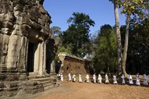 Cambodia Gallery: A procession of Buddhist nuns file through the temples of Angkor, UNESCO World Heritage Site