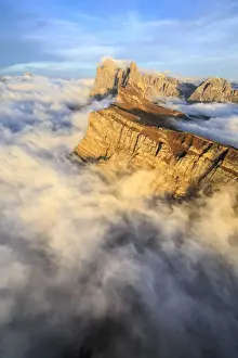 Pinnacles Prints: The profiles of the pinnacles of the Geisler Group in the Dolomites emerging from the fog at sunset