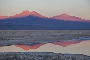 Flat Prints: The profiles of two volcanos of the Cordillera de la Sal reflecting in a pool in the Desert of Atacama