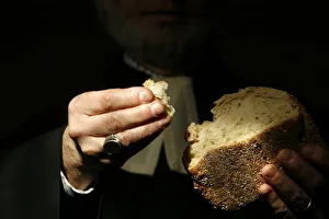 Images Dated 5th February 2007: Protestant minister holding Communion bread, Geneva, Switzerland, Europe