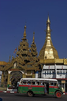Public bus drives past Sule Pagoda, Yangon (Rangoon), Myanmar (Burma), Asia