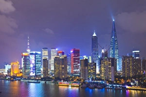 Pudong skyline at night across the Huangpu River, Shanghai, China, Asia