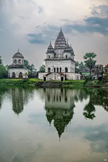 Worship Prints: Puthia Rajbari Complex with reflections on water in Bangladesh during the evening