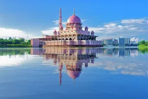 Minaret Prints: Putra Mosque stands over the lake in Putrajaya with clear sky and reflections on the water