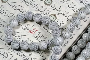 Closeup View Gallery: Quran and Tasbih (prayer beads), with Allah monogram in red, Haute-Savoie, France, Europe