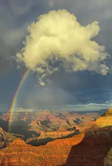 Wonders Prints: Rainbow appears over the Grand Canyon during afternoon with clouds in the sky