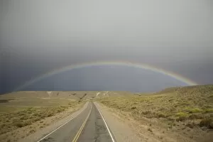 Rainbow above the Pampas and highway, Argentina, South America