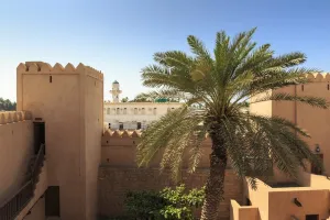 Ramparts Prints: Ramparts, palm tree and view to mosque, Taqah (Taqa) Castle fort museum, near Salalah