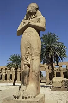 Images Dated 6th January 2000: Ramses II and daughter Bant Anta, in forecourt of the temple of Karnak