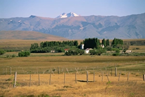 Ranches Prints: Ranch at Villa Castillo, farmland and mountains behind, in Patagonia, Chile
