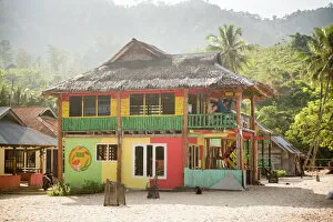 Thatch Collection: Rasta (Rastafarian) coloured beachfront accommodation at Sungai Pinang, near Padang in West Sumatra