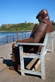 Ray Lonsdale sculpture of a Man on a Bench in North Bay, Scarborough, North Yorkshire, Yorkshire, England, United Kingdom, Europe