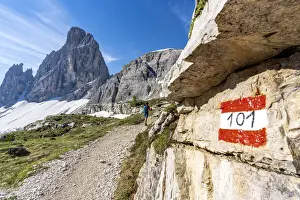 40 To 45 Prints: Rear view of hiker woman walking on path to majestic Croda Dei Toni mountain