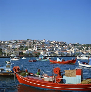 Red and blue painted fishing boats in the harbour in