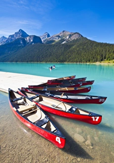 Rocky Mountains Prints: Red canoes for hire on Lake Louise