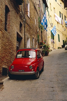 Typical Prints: Red car parked in narrow street
