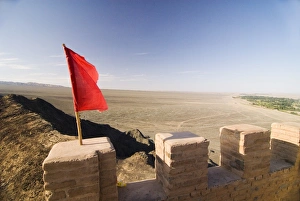 Red Flag flying on overhanging great wall, UNESCO World Heritage Site, Jiayuguan