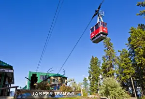 Gondolas Prints: Red Gondola car on the Jasper tramway rising up Whistler mountain