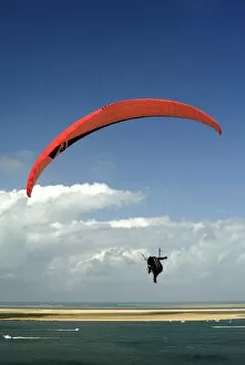 Images Dated 31st August 2008: Red hang glider over Bay of Arcachon, Gironde, Aquitaine, France, Europe
